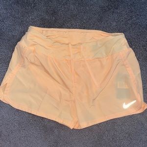 Orange Nike shorts